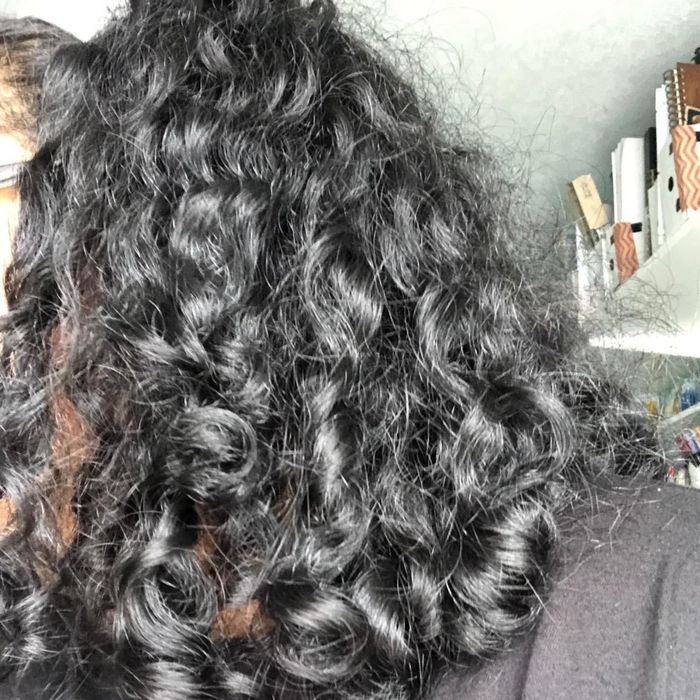 A reviewer’s photo of their smooth, tangle-free curls