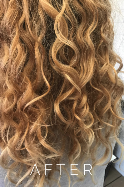 A review photo of hair after using the product, showcasing well-defined curls and significantly reduced frizz