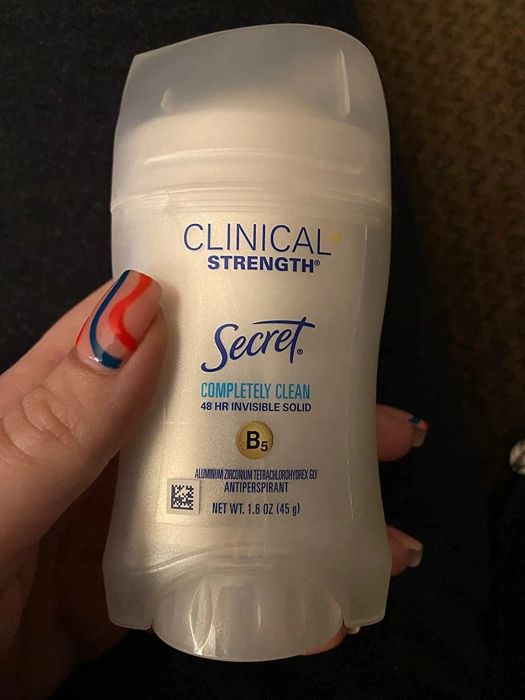 a reviewer holding the deodorant