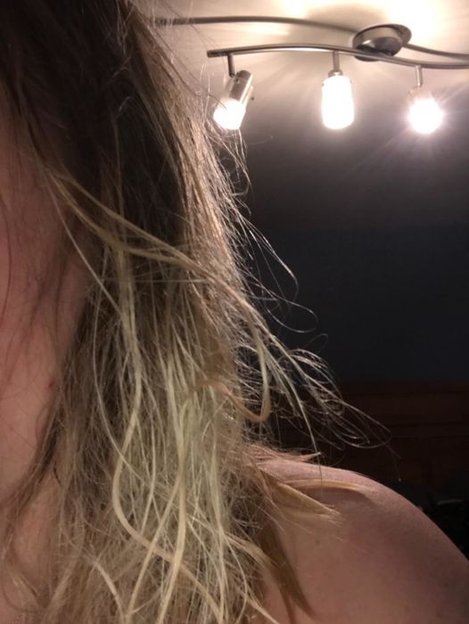 Reviewer showcasing tangled hair before the transformation