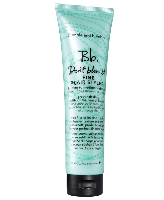 the green bottle of the styling product