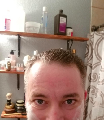 The same reviewer displaying their hair neatly slicked back using the holding gel