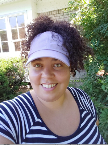 Reviewer wearing the light purple version of the product