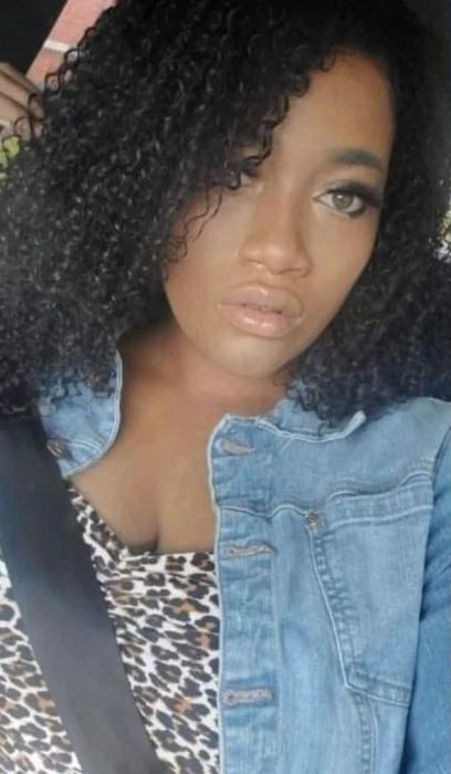 Reviewer with very curly hair looking soft and shiny after using the product