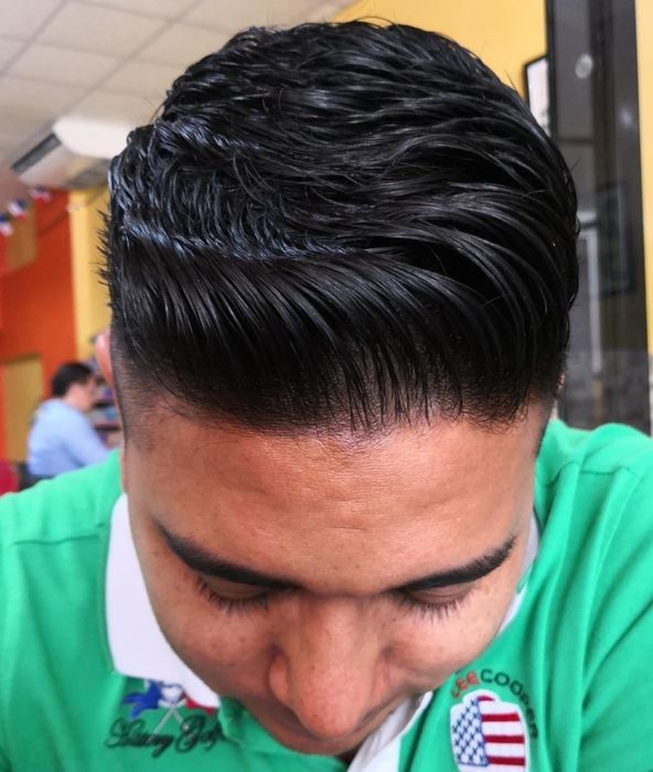 A reviewer with textured, voluminous hair after using the hair stick