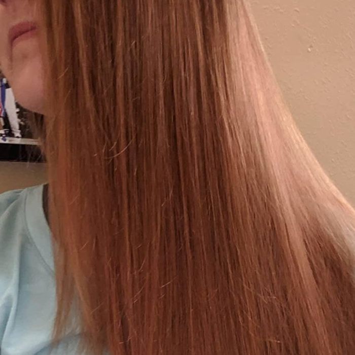 Photo of a reviewer’s orange hair after using the product