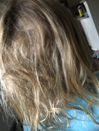reviewer's child with messy, tangled hair