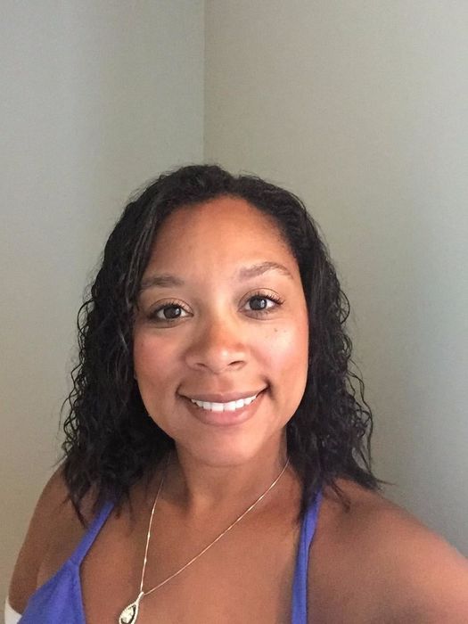 same reviewer showcasing smooth, frizz-free curls