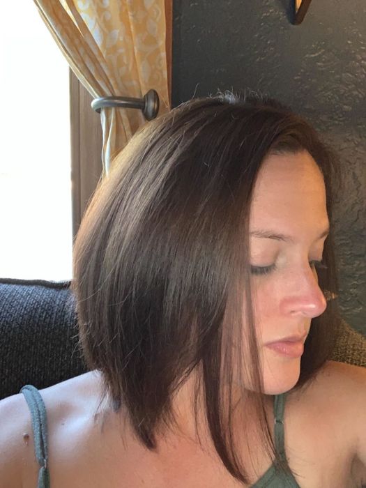 Reviewer displaying their sleek, glossy hair after using the shampoo