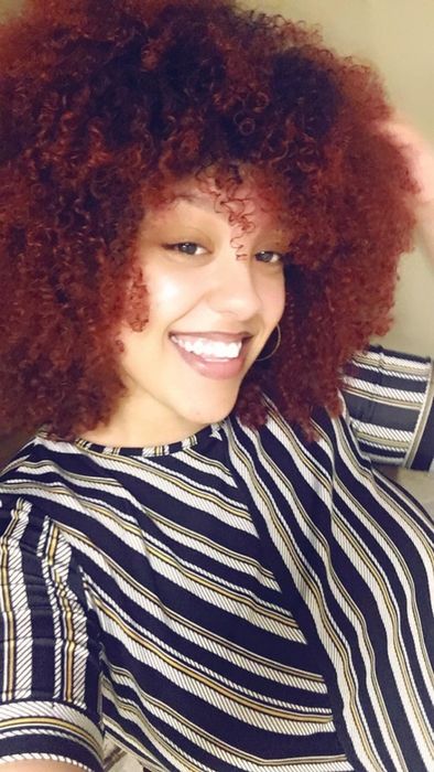 Reviewer with naturally voluminous, healthy, and glossy hair