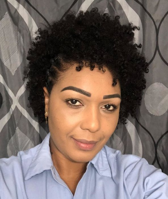 A reviewer’s photo displaying well-defined curls after using the mousse