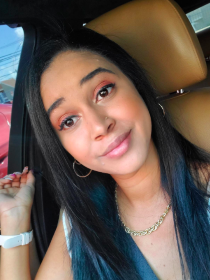 A reviewer displaying their sleek, straight hair