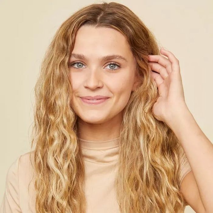 a model showcasing soft, beachy waves