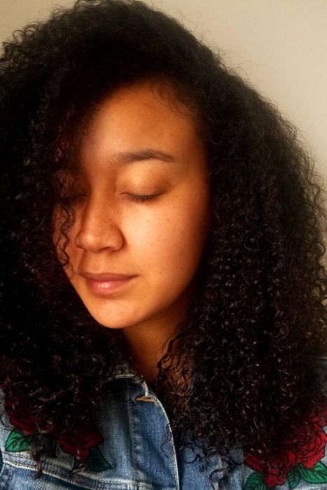 After photo of the same reviewer showcasing their curls with enhanced definition after using the hairdryer