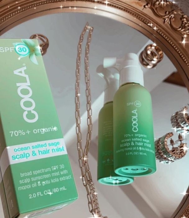 reviewer's photo of the hair mist placed on a tray with the caption 'soooo stoked about this sunscreen hair mist for scalp protection'