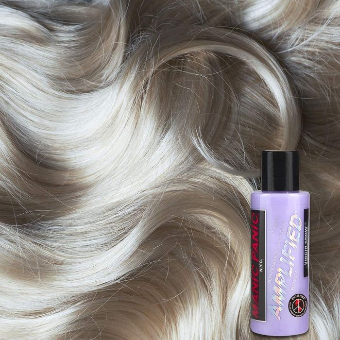 A model showcasing platinum blonde hair after using the Manic Panic toner