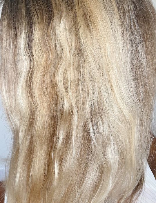 A close-up of Britt’s wavy hair looking deeply hydrated