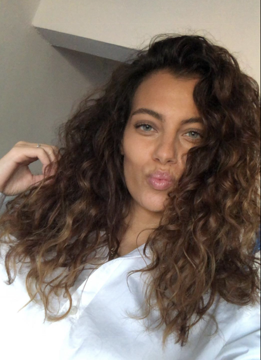 A reviewer’s hair styled using the product