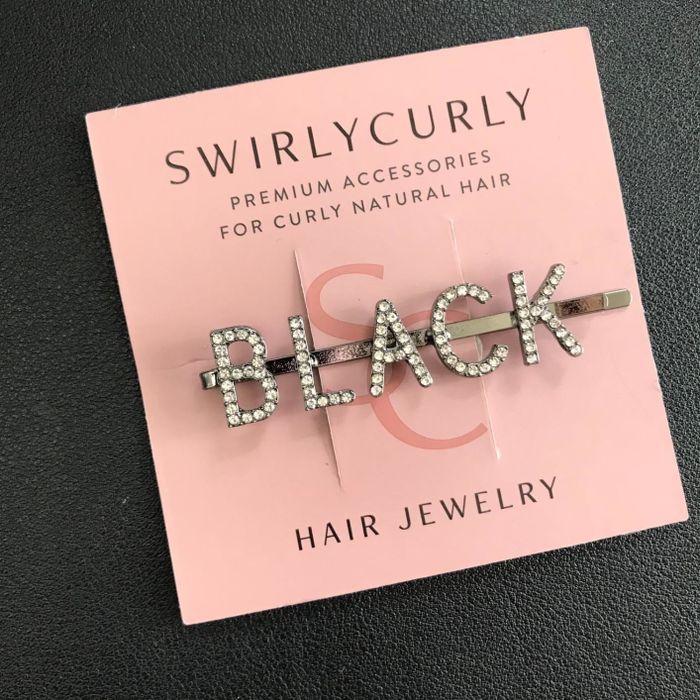 Reviewer photo of a pin that says, 