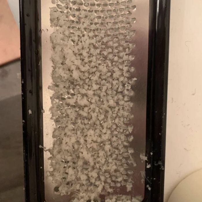 A customer review photo of the foot file covered in dead skin after use