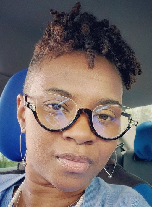 A reviewer’s photo showcasing well-defined curls after applying the leave-in conditioner