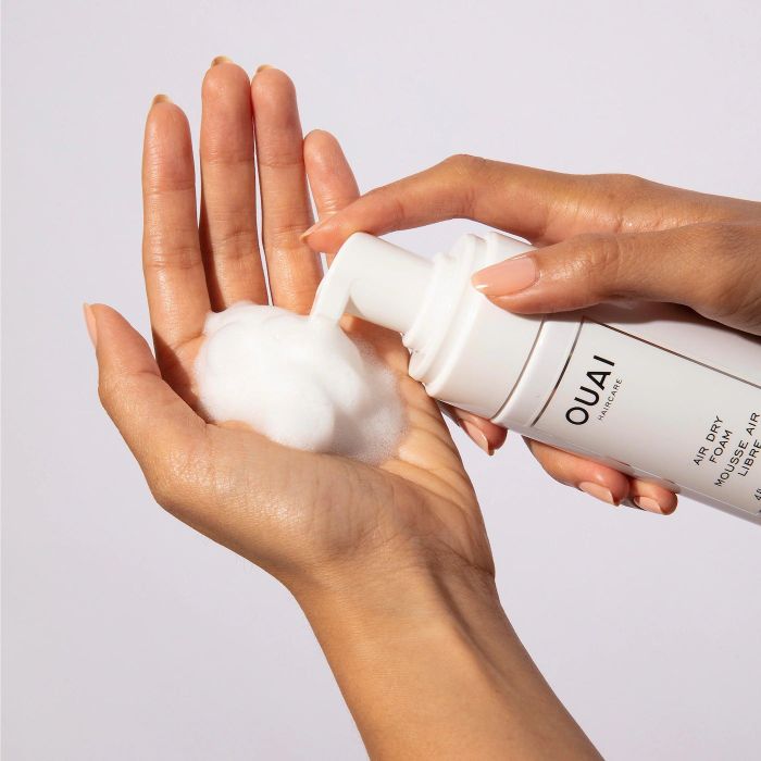 a model dispensing the foam into their hand