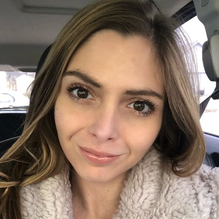 A reviewer wearing the concealer to showcase its application