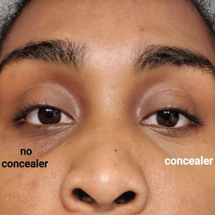 A reviewer showcasing the concealer applied to one eye