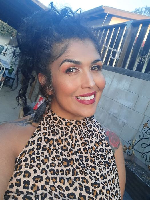 reviewer showcasing matte lipstick