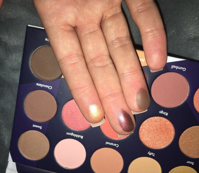 image of three shades swatched on a reviewer's fingers