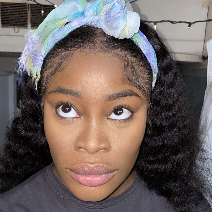 A reviewer demonstrating the concealer applied to their face