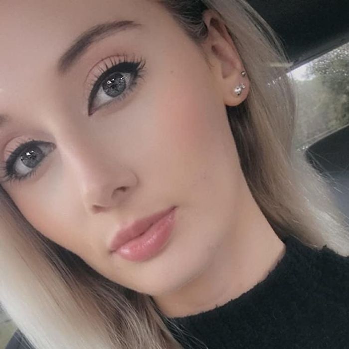 A reviewer wearing the concealer to demonstrate its application