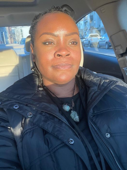 A reviewer showcasing a radiant makeup look after using the same makeup brushes.