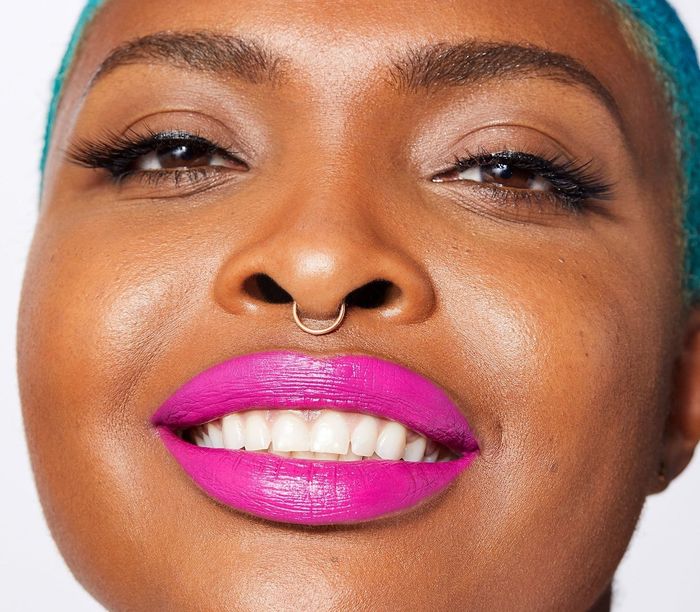 a model flaunting a vibrant pink lipstick
