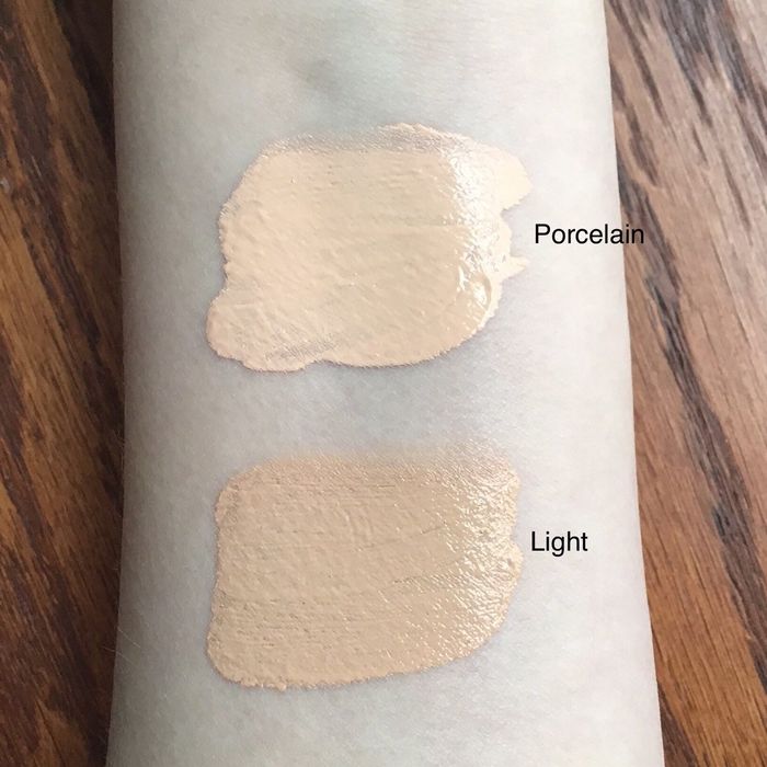 a reviewer's arm displaying two swatches of the tinted hydrator, highlighting the shade range and its smooth texture