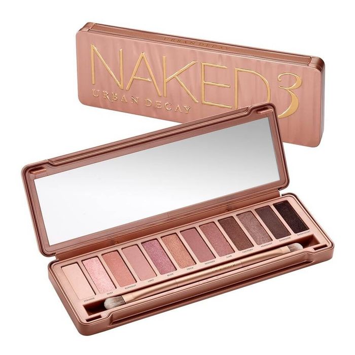 The Urban Decay Naked 3 palette, displayed with its packaging in the background.