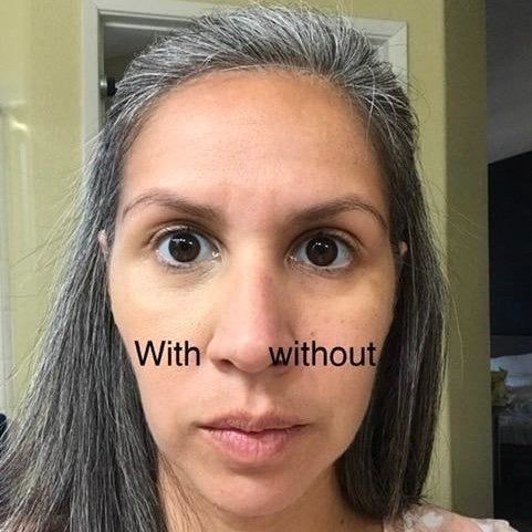 A reviewer demonstrating the concealer applied to one eye