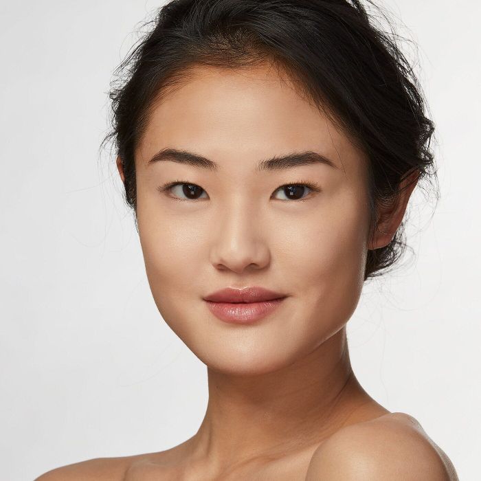 another model displaying a different shade of the foundation on their face