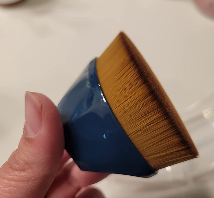 A side view of a reviewer’s foundation brush.