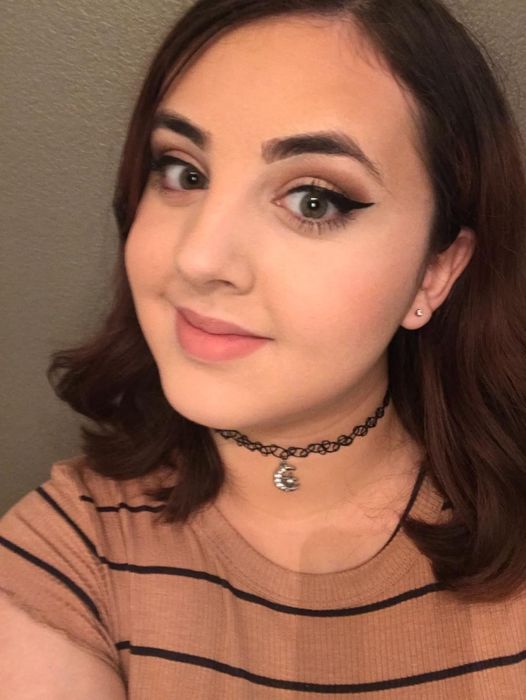 A reviewer showcasing their cat-eye eyeliner look