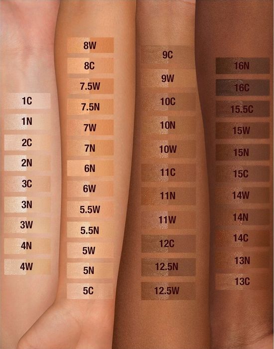 four models' arms displaying swatches of the foundation in various shades