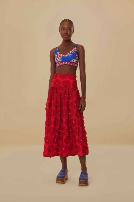 model showcasing the bright red skirt