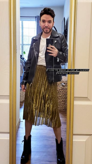 reviewer styling the gold midi version with a moto jacket