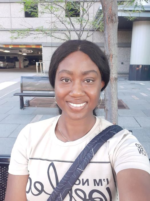 reviewer showcasing deep golden foundation applied to the face