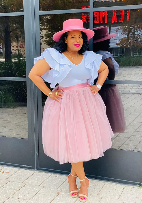 reviewer in the light pink version of the skirt