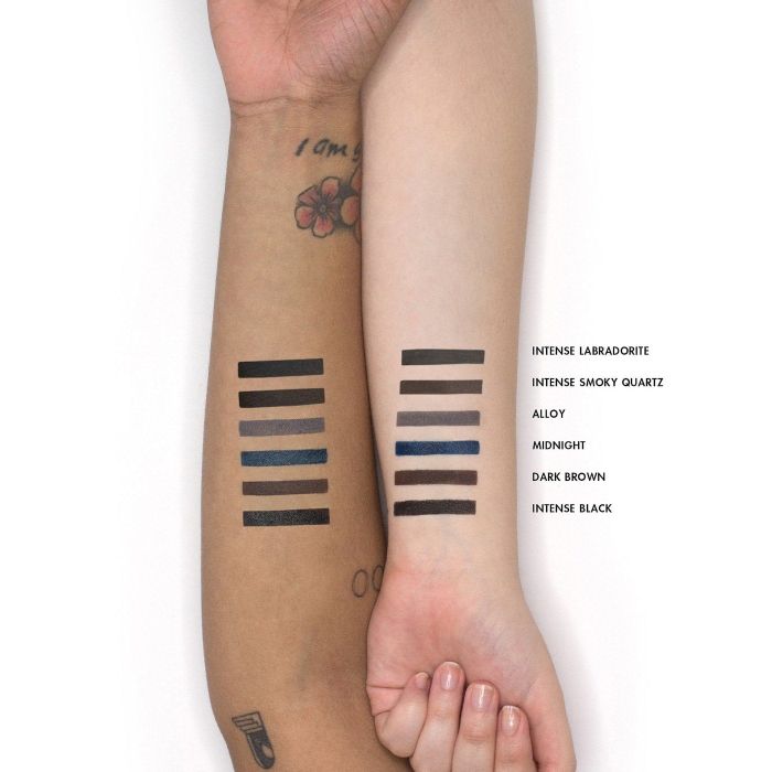 two models' arms displaying swatches of the liner in different shades