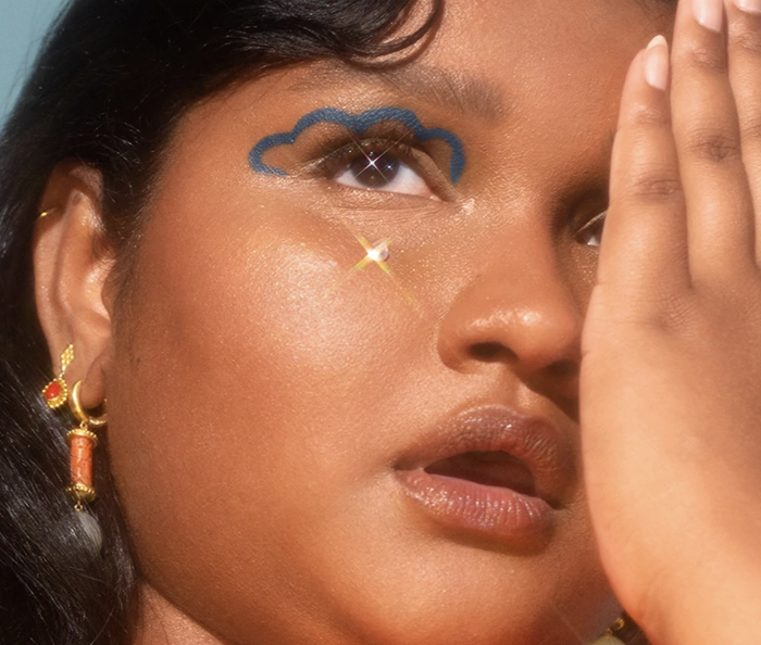 a model wearing the rain check blue eyeliner