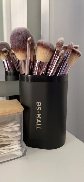 Makeup brushes neatly arranged in a black BS-MALL holder.