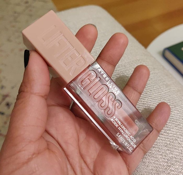 A reviewer holding the product in their hand.
