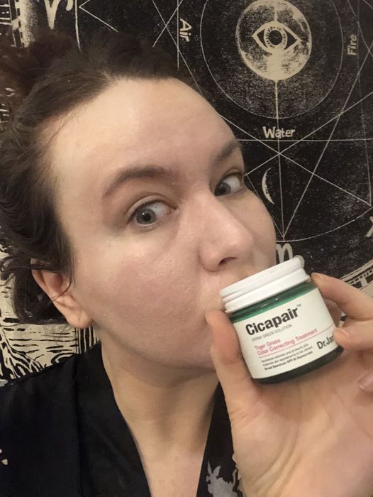 The writer's full face after applying the product, with redness significantly reduced